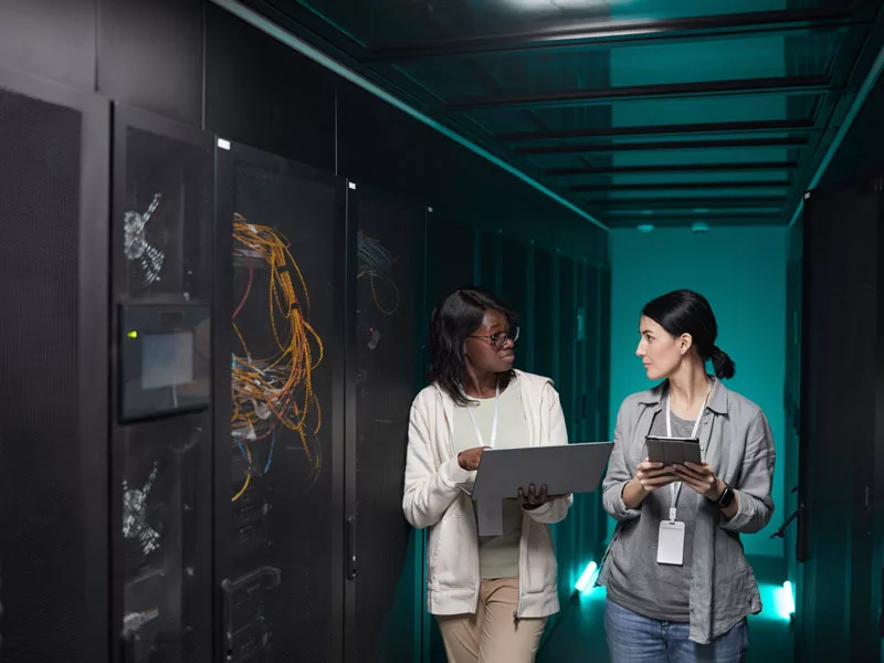 two women in data center to illustrate data bacjup and disaster recovery