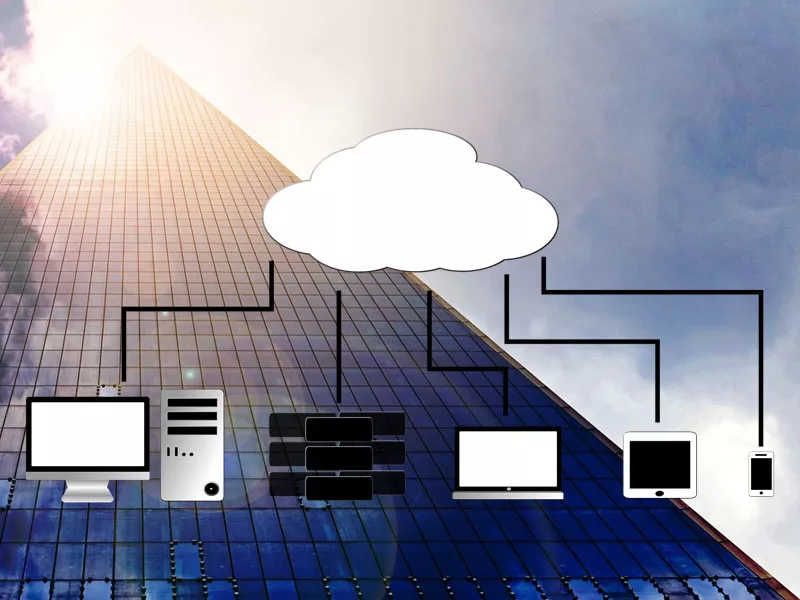 Devices using managed cloud services against a skyscraper