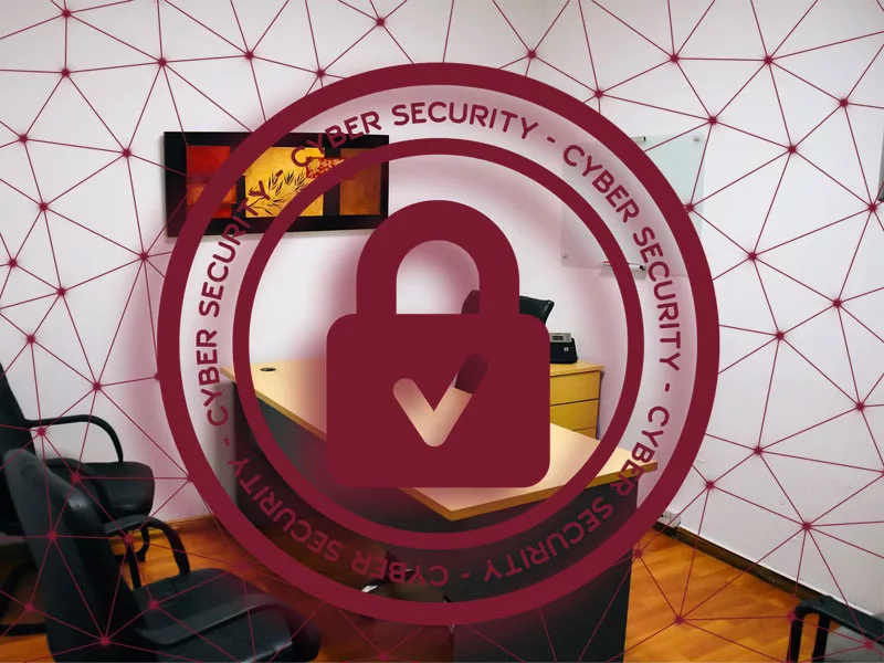 A locked graphic against a small office to illustrate cybersecurity for small businesses