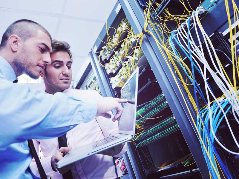 engineers checking a network to illustrate benefits of managed IT