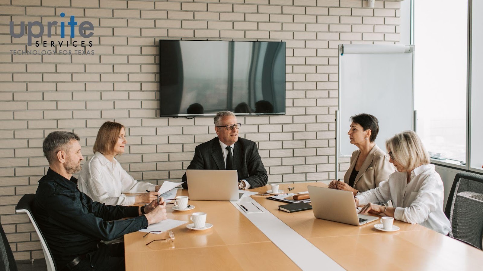 undefined (1) IT manager reviewing reports to measure MSP performance and ROI